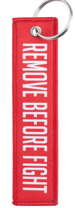 Varusteleka avaimenperä, NIMI + REMOVE BEFORE FIGHT